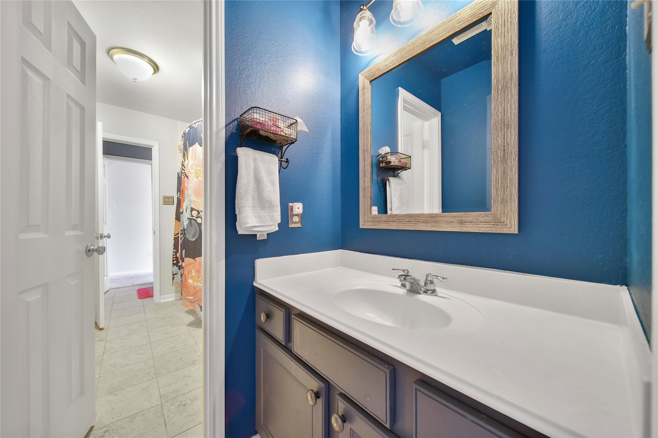 1279 Pinto Pass Alvin, TX 77511 - Photo 25 of 31 a bathroom with a sink and a mirror