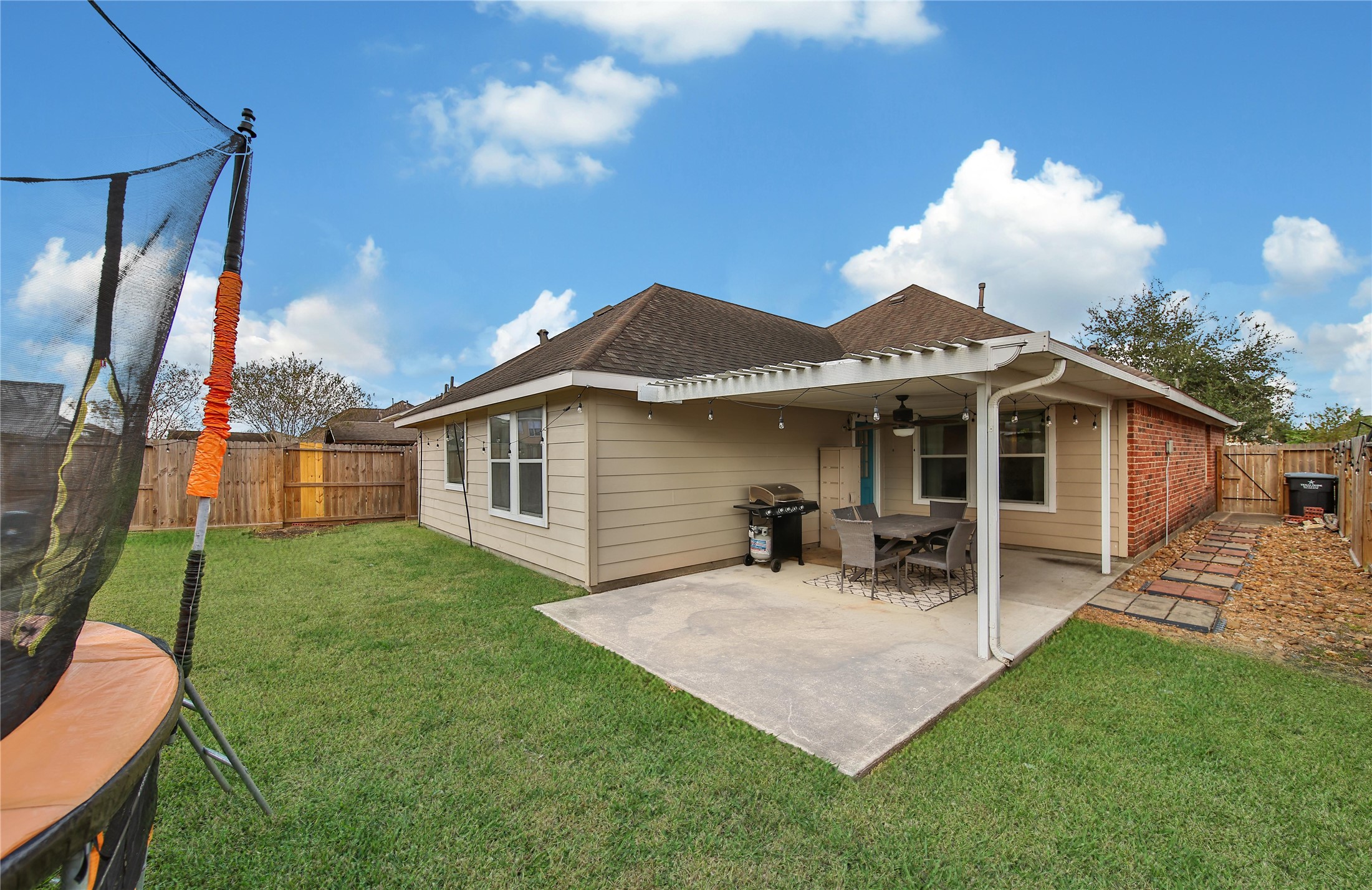 1279 Pinto Pass Alvin, TX 77511 - Photo 28 of 31 a front view of a house with patio