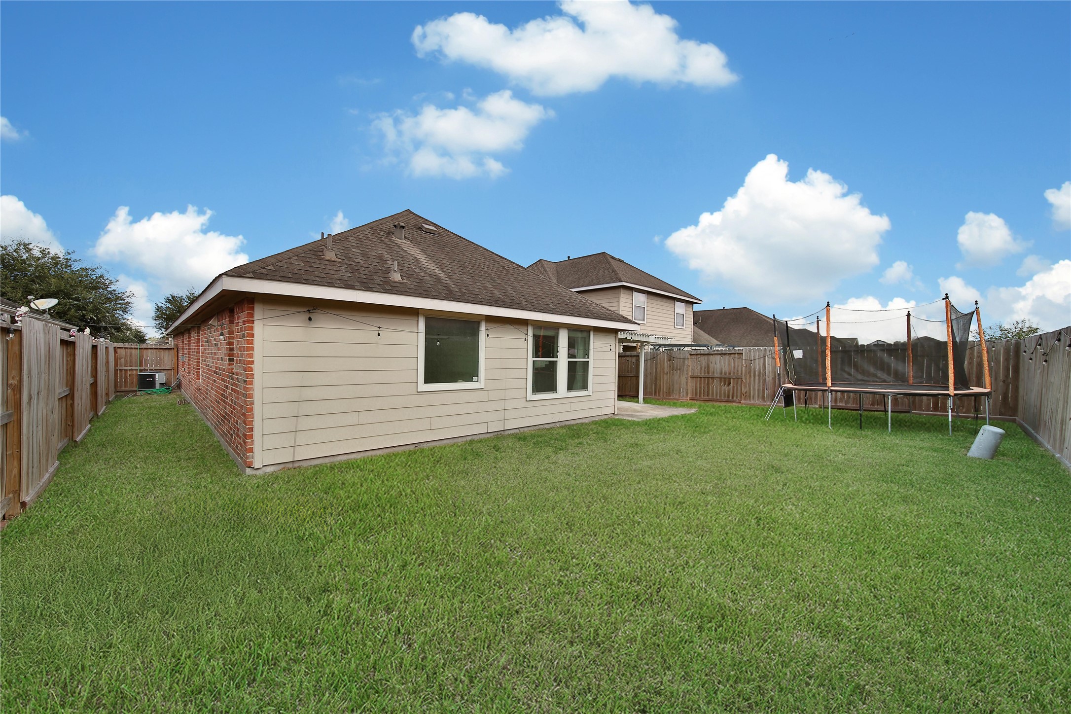 1279 Pinto Pass Alvin, TX 77511 - Photo 30 of 31 a front view of a house with garden