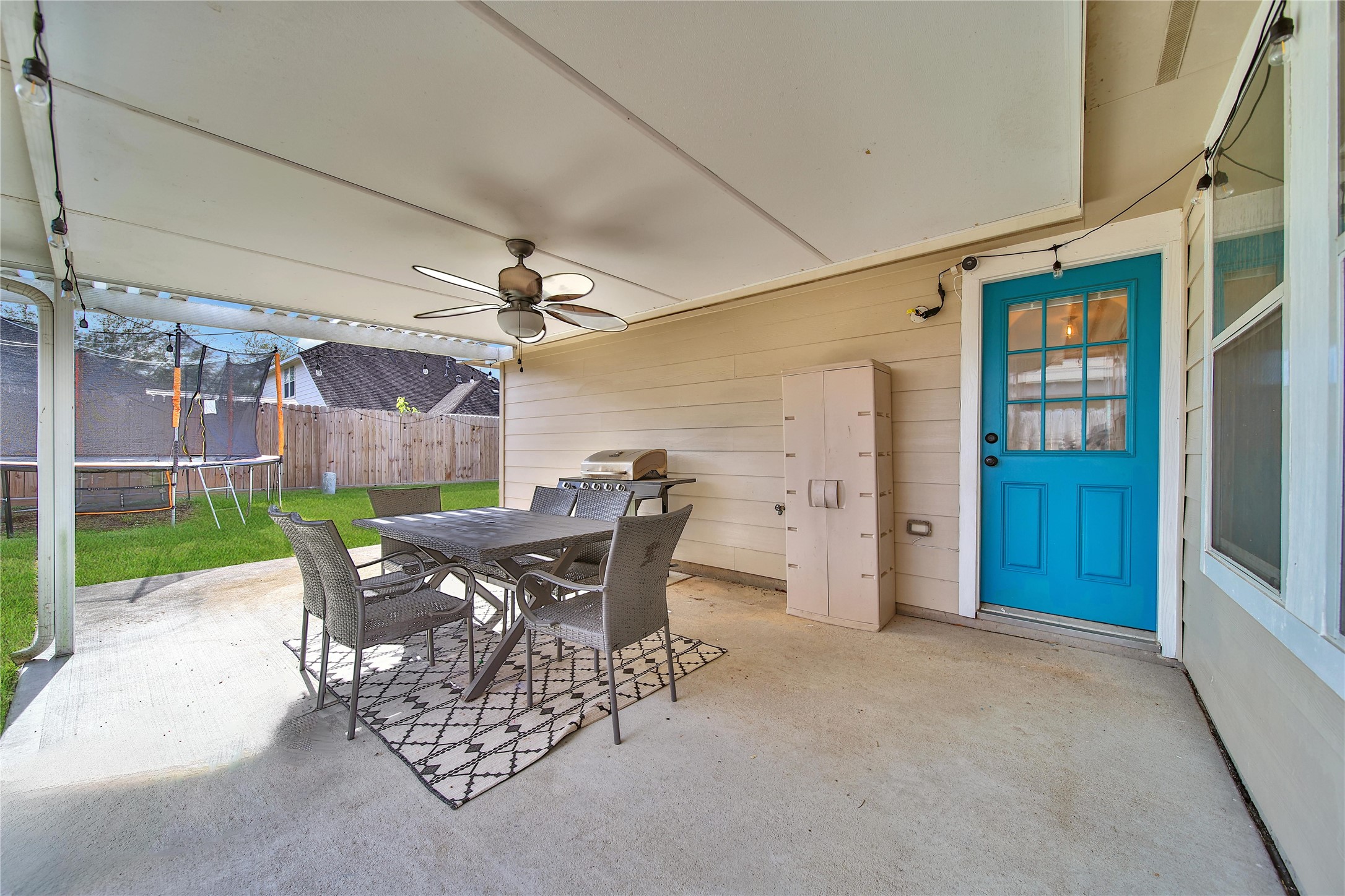 1279 Pinto Pass Alvin, TX 77511 - Photo 5 of 31 a view of a patio with a table and chairs