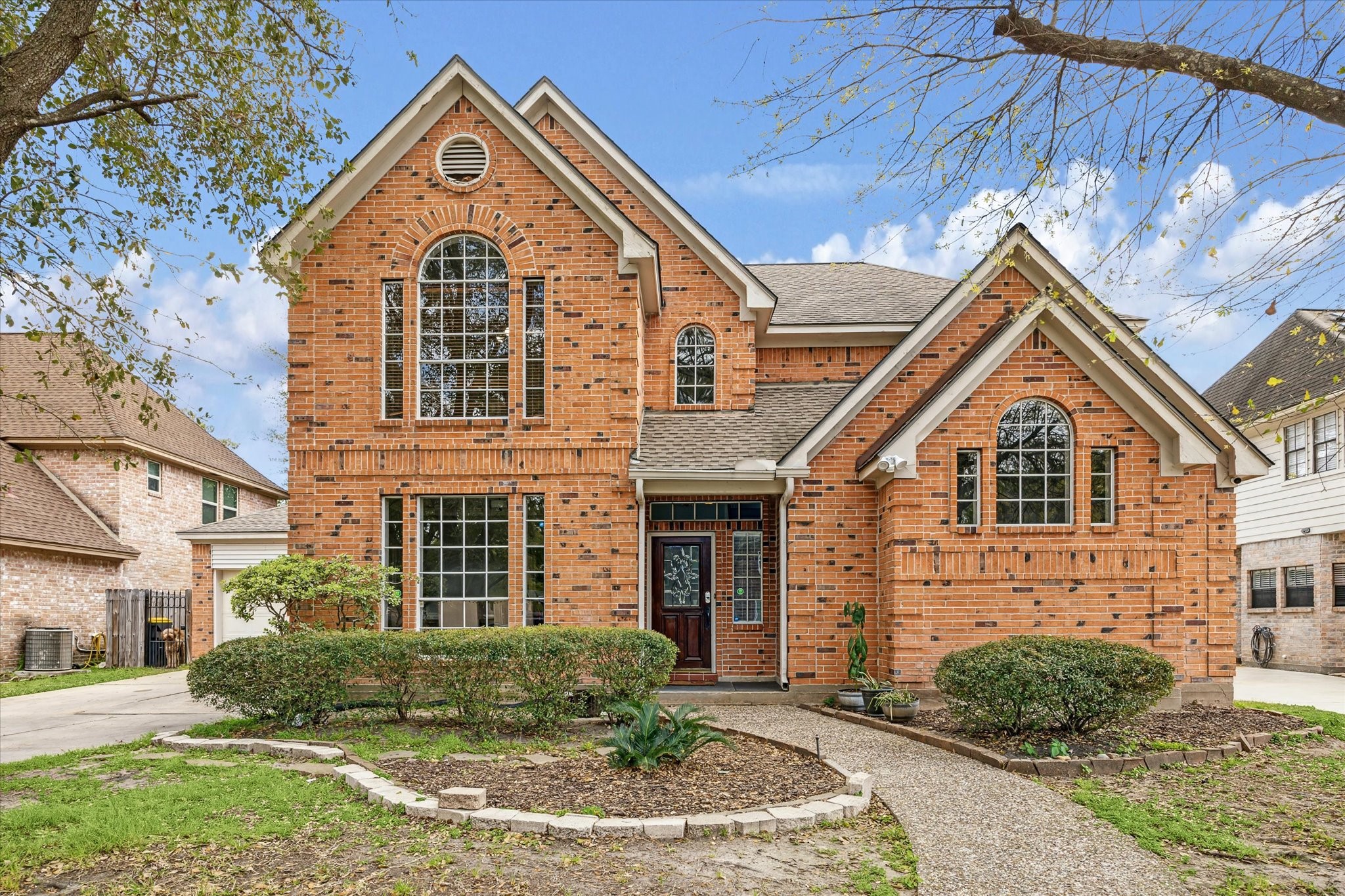 15314 Ripplewind Lane Houston, TX 77068 - Photo 24 of 24 a front view of a house with garden
