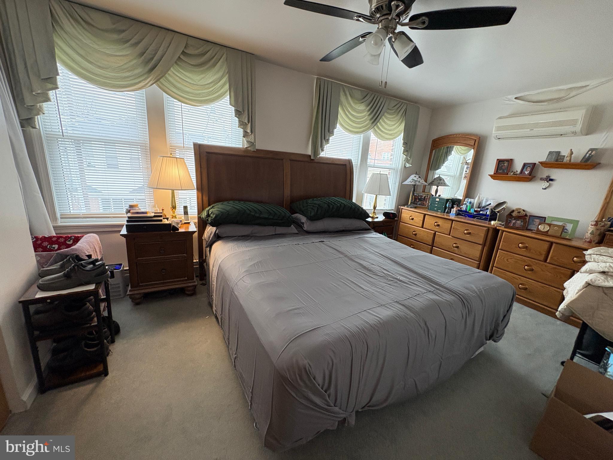 15 South Forklanding Road Maple Shade, NJ 08052 - Photo 9 of 30 a bedroom with a bed and a chandelier