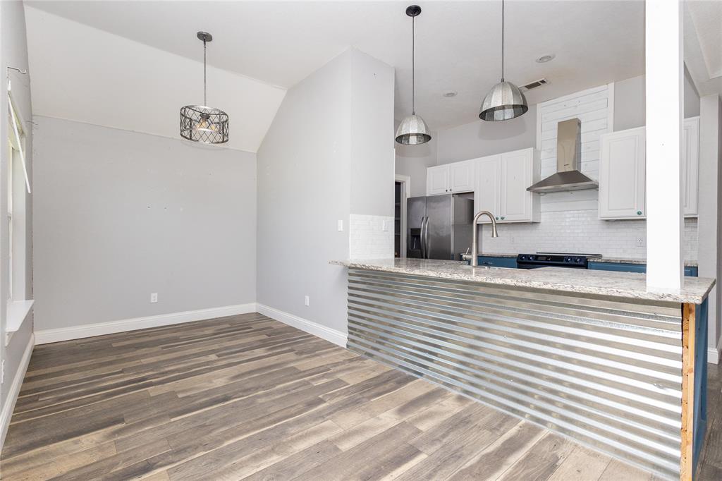 512 Milton Road Josephine, TX 75173 - Photo 8 of 31 a view of a kitchen with wooden floor