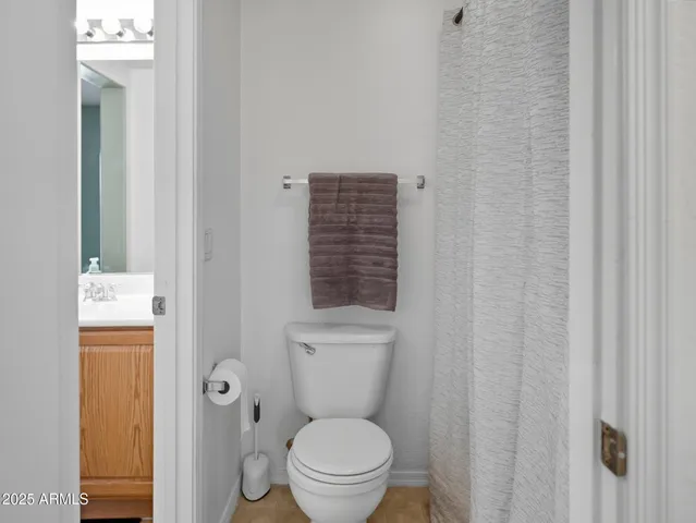 a bathroom with a toilet and a sink