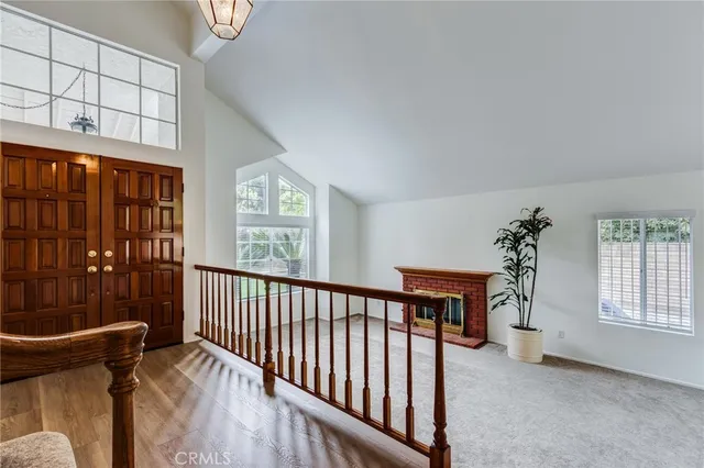a view of entryway with a window and wooden floor