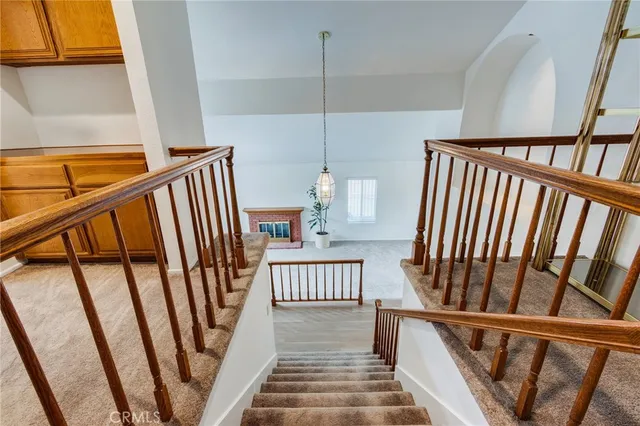 a view of staircase with black and white floor