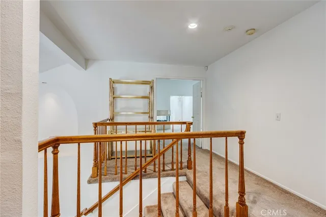 a view of a hallway with windows