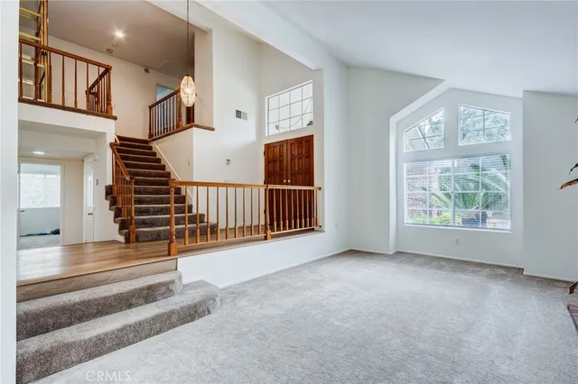 a view of a living room and entryway