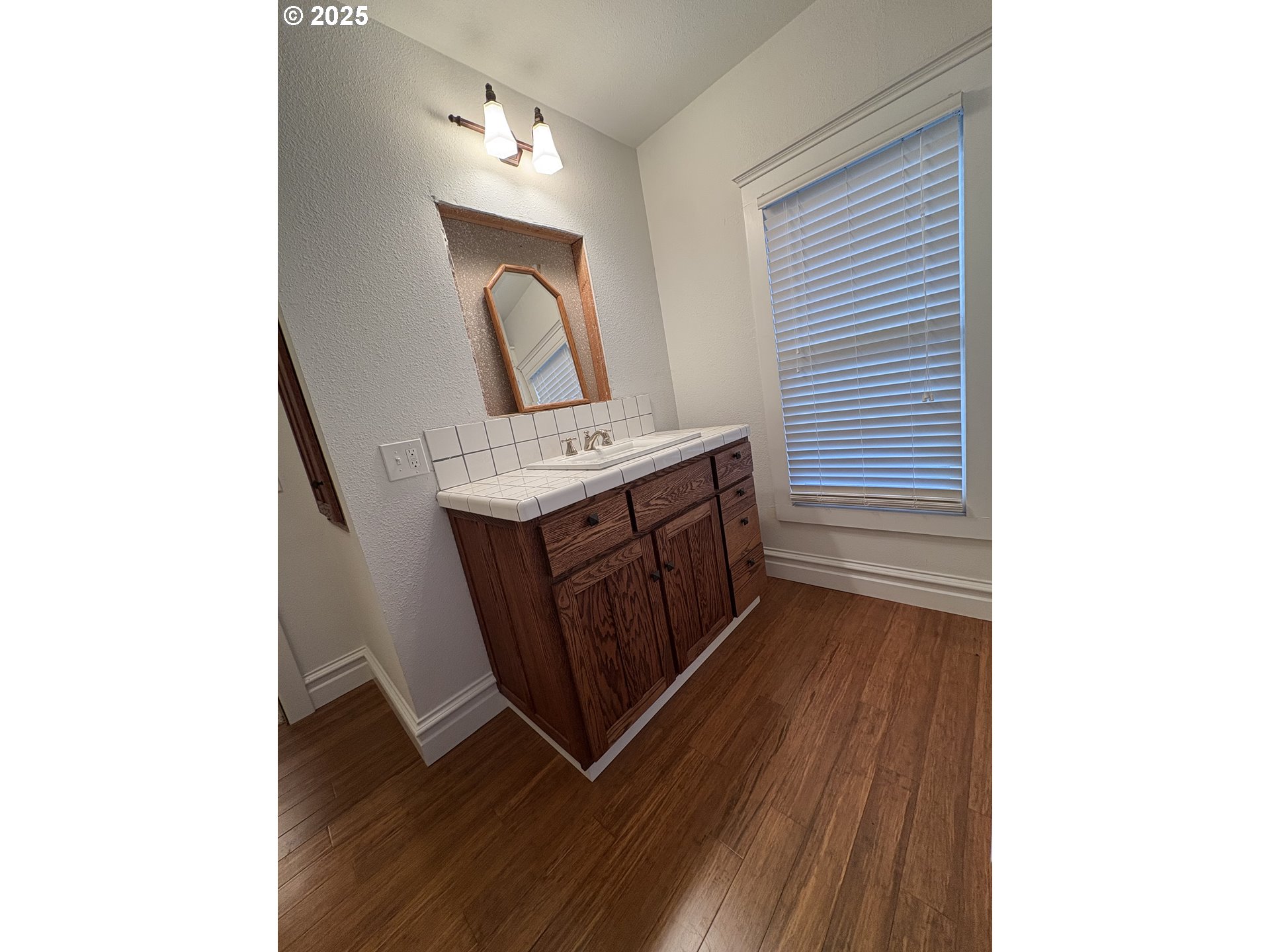 430 West Water Street Stayton, OR 97383 - Photo 20 of 42 a room with a sink and a mirror