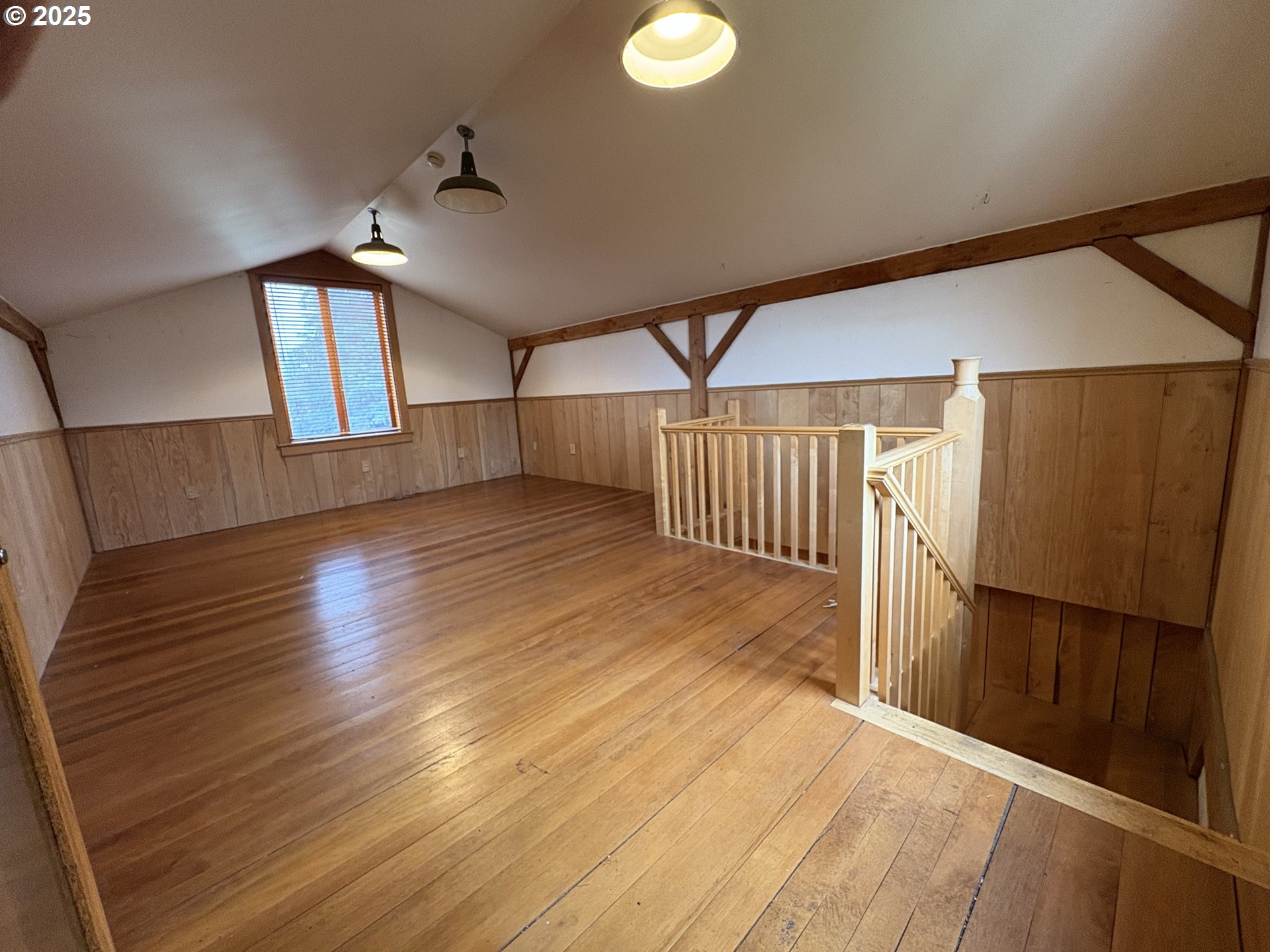 430 West Water Street Stayton, OR 97383 - Photo 31 of 42 an empty room with wooden floor door and windows