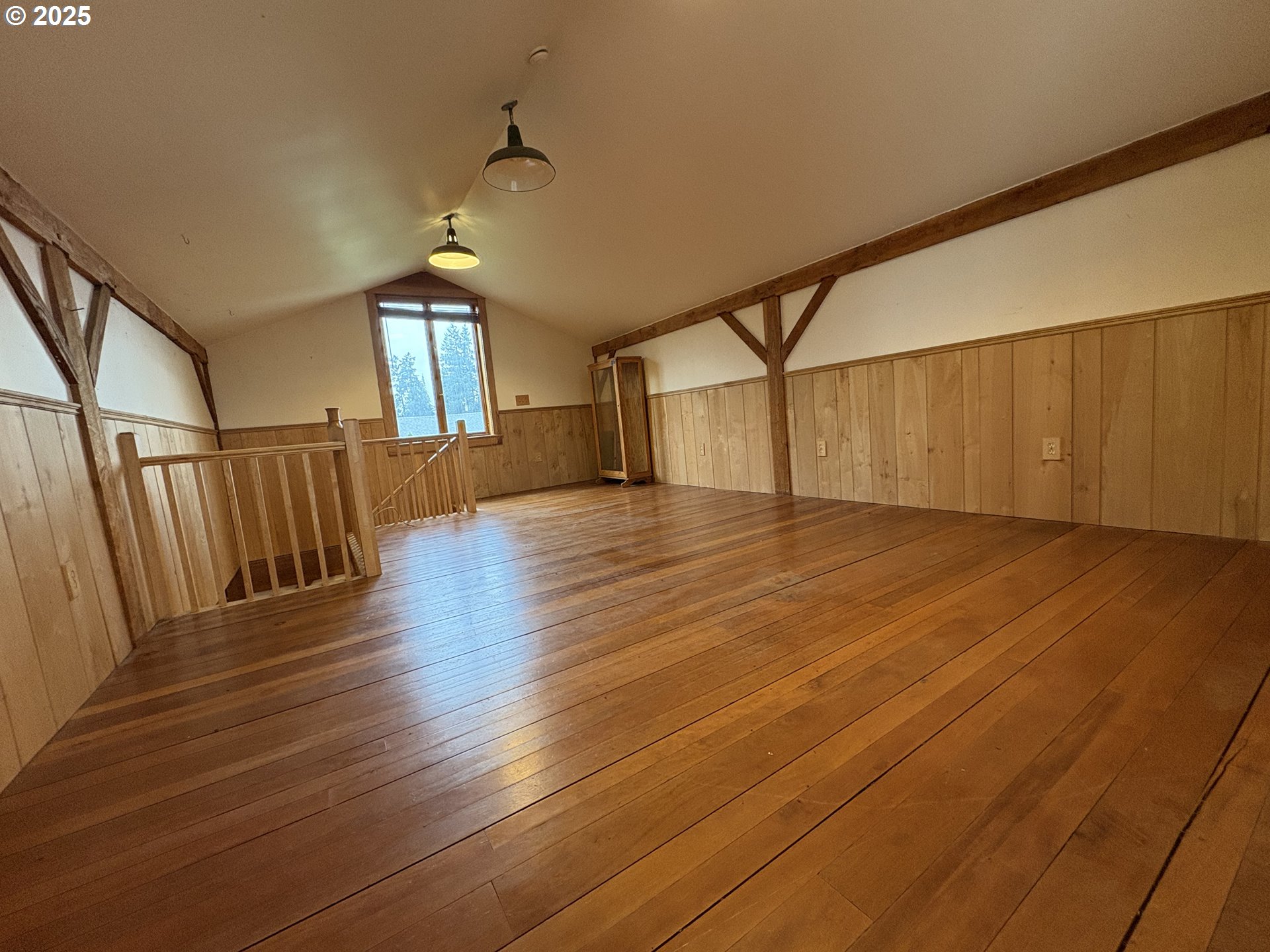 430 West Water Street Stayton, OR 97383 - Photo 32 of 42 a view of empty room with wooden floor