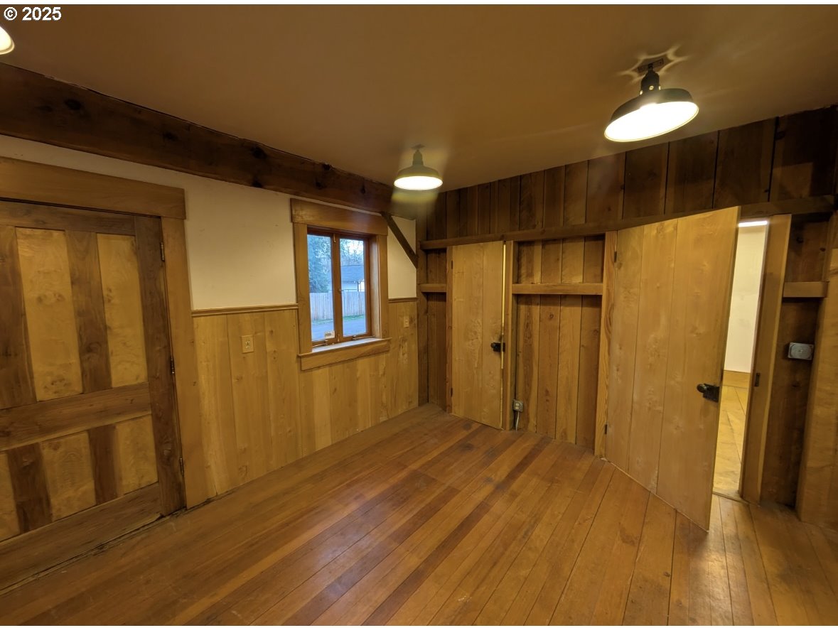 430 West Water Street Stayton, OR 97383 - Photo 36 of 42 a view of a hallway with wooden floor and cabinet