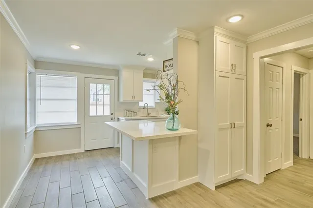 a bathroom with a sink a mirror and a shower