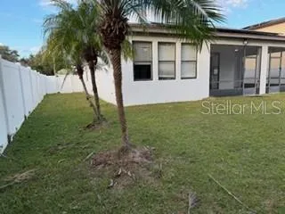 a view of house with yard