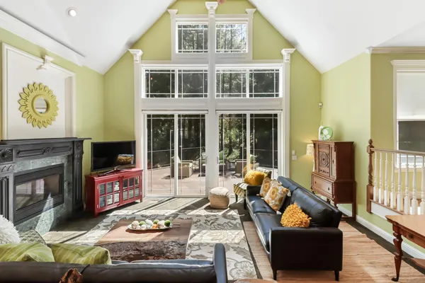 a kitchen with a table chairs microwave and cabinets