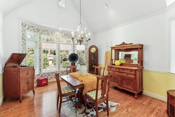 a bedroom with a bed couch and a window