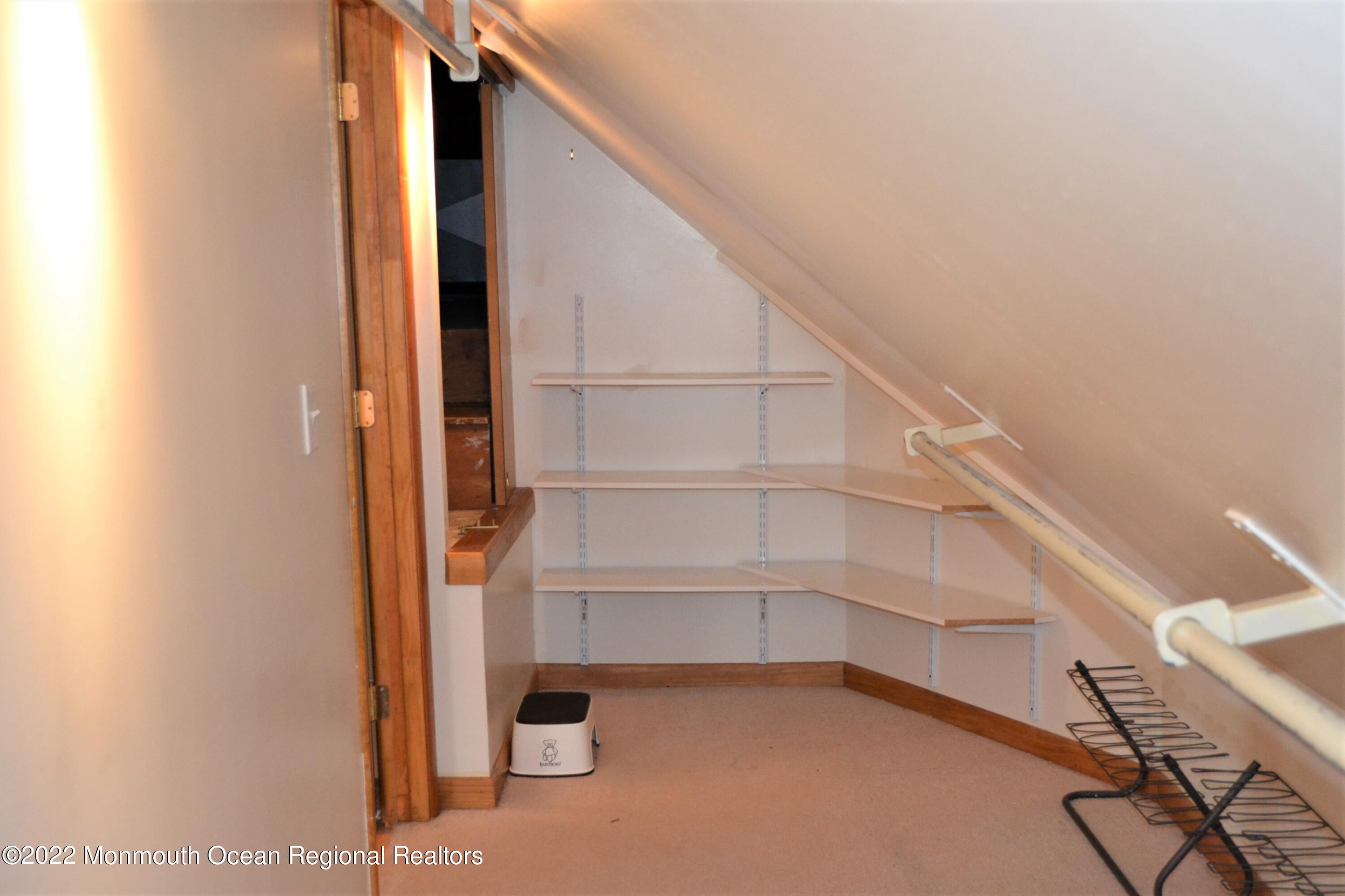 319 Boulevard Kenilworth, NJ 07033 - Photo 26 of 40 master bedroom walk in closet up to atti
