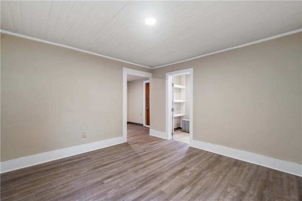 528 3rd Street Charleroi, PA 15022 - Photo 29 of 50 a view of an empty room with wooden floor