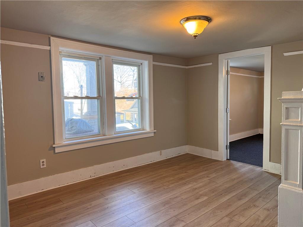 528 3rd Street Charleroi, PA 15022 - Photo 39 of 50 a view of an empty room with wooden floor and a window