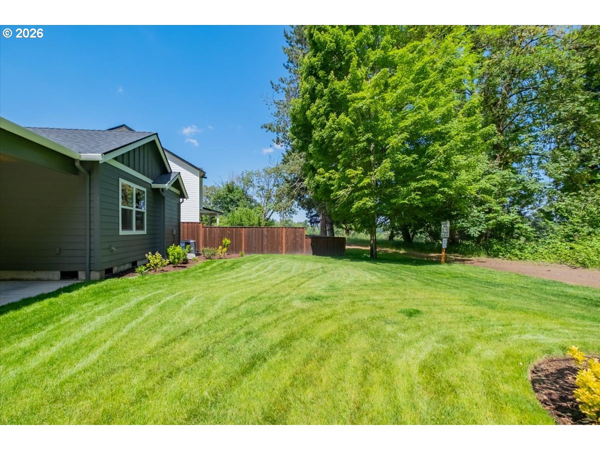 2147 Northeast Spitz Road Canby, OR 97013 - Photo 42 of 48 a backyard of a house with lots of green space