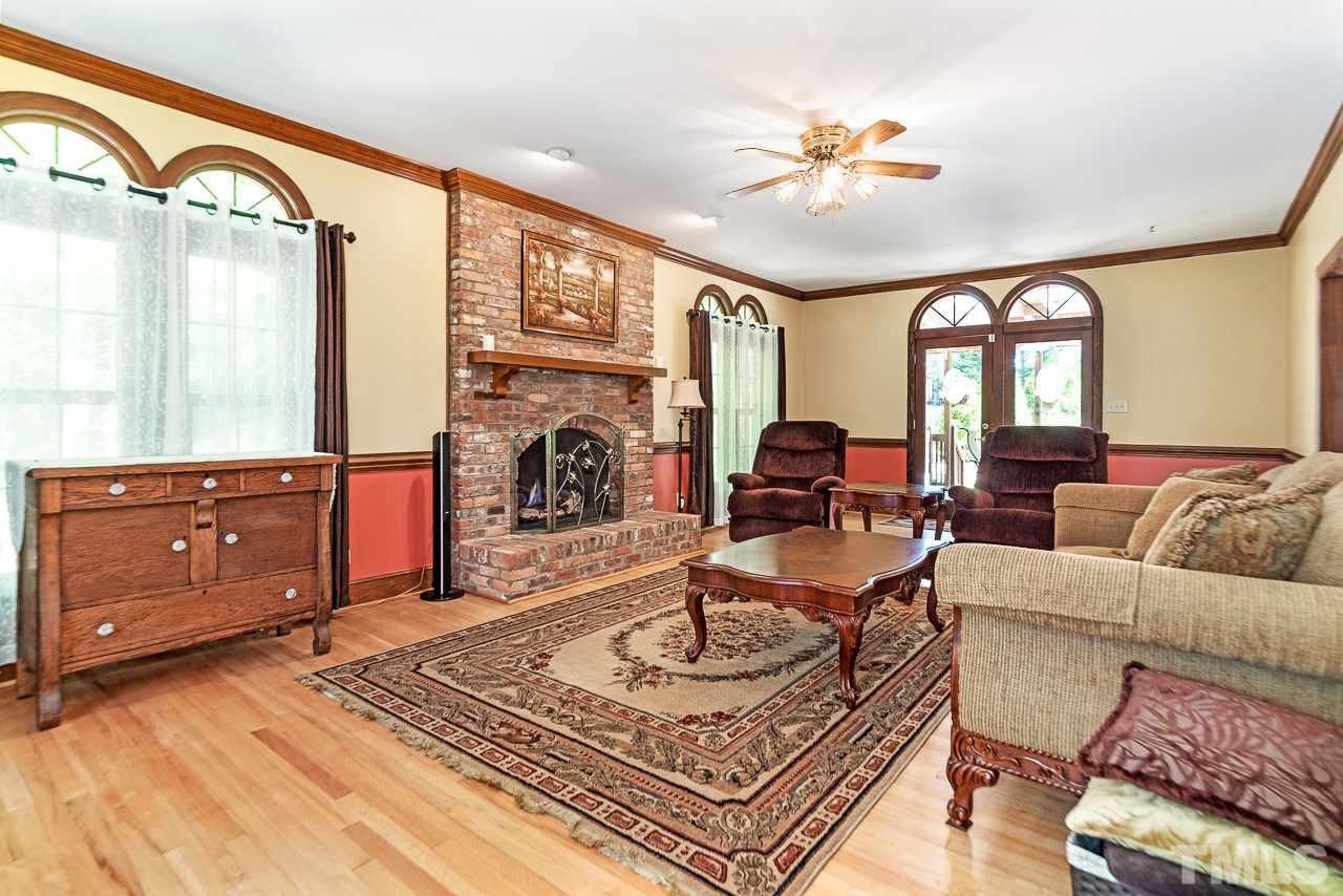 3005 Daventry Lane Raleigh, NC 27613 - Photo 12 of 30 Large family room with fireplace & lovely hardwoods.