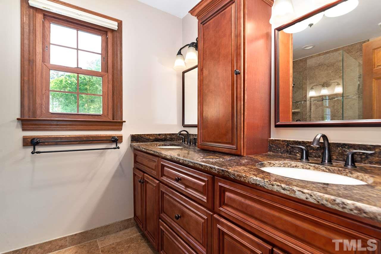 3005 Daventry Lane Raleigh, NC 27613 - Photo 18 of 30 Dual sinks with granite counter tops.