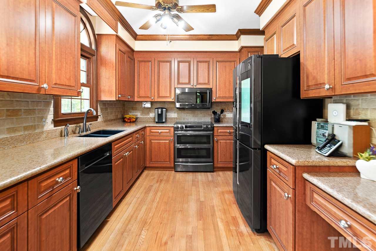 3005 Daventry Lane Raleigh, NC 27613 - Photo 4 of 30 Lovely remodeled kitchen with cherry cabinets, plenty of counter space and cabinets.