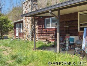 2185 Deep Gap Road Hendersonville, NC 28792 - Photo 6 of 10 a view of a house with backyard sitting area and garden