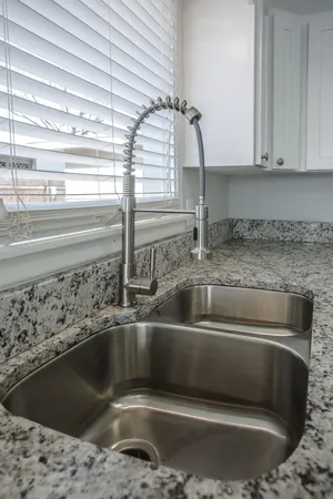 a kitchen with a sink and a window