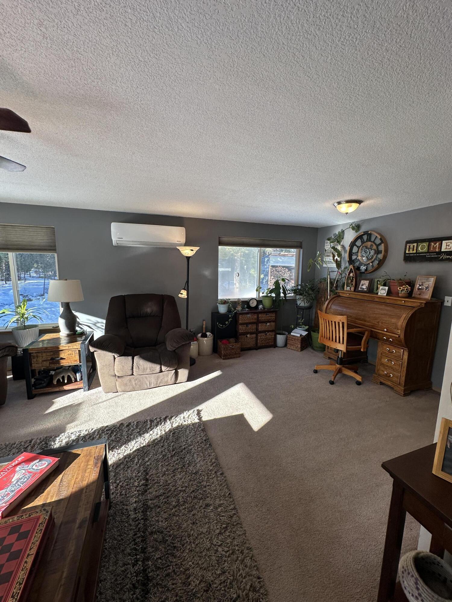 123977 Surveyor Road Crescent Lake, OR 97733 - Photo 13 of 41 a living room with furniture and a flat screen tv