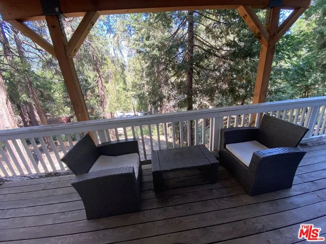 a view of a balcony with furniture