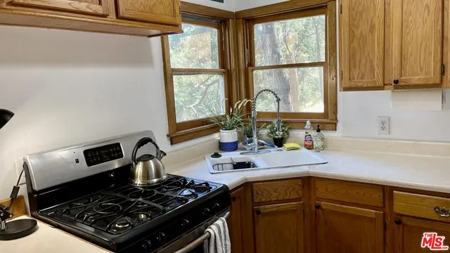 a kitchen with a stove and a sink