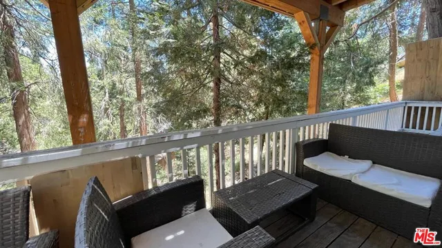 a view of a two chairs in the balcony