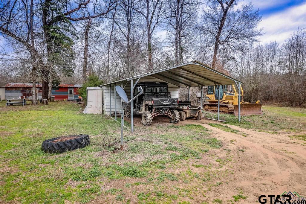 1322 Reklaw Tx 75784 Rusk, TX 75785 - Photo 10 of 22 a view of a house with backyard and sitting area