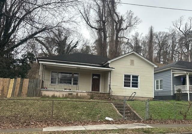 210 East Main Street Southwest Rome, GA 30161 - Photo 1 of 4 a front view of a house with garden
