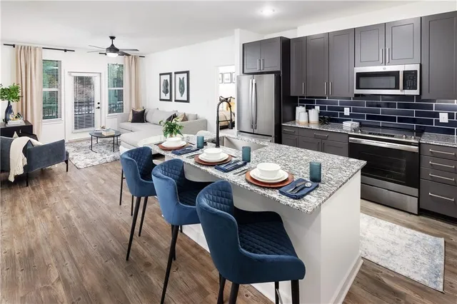 a kitchen with a dining table and chairs