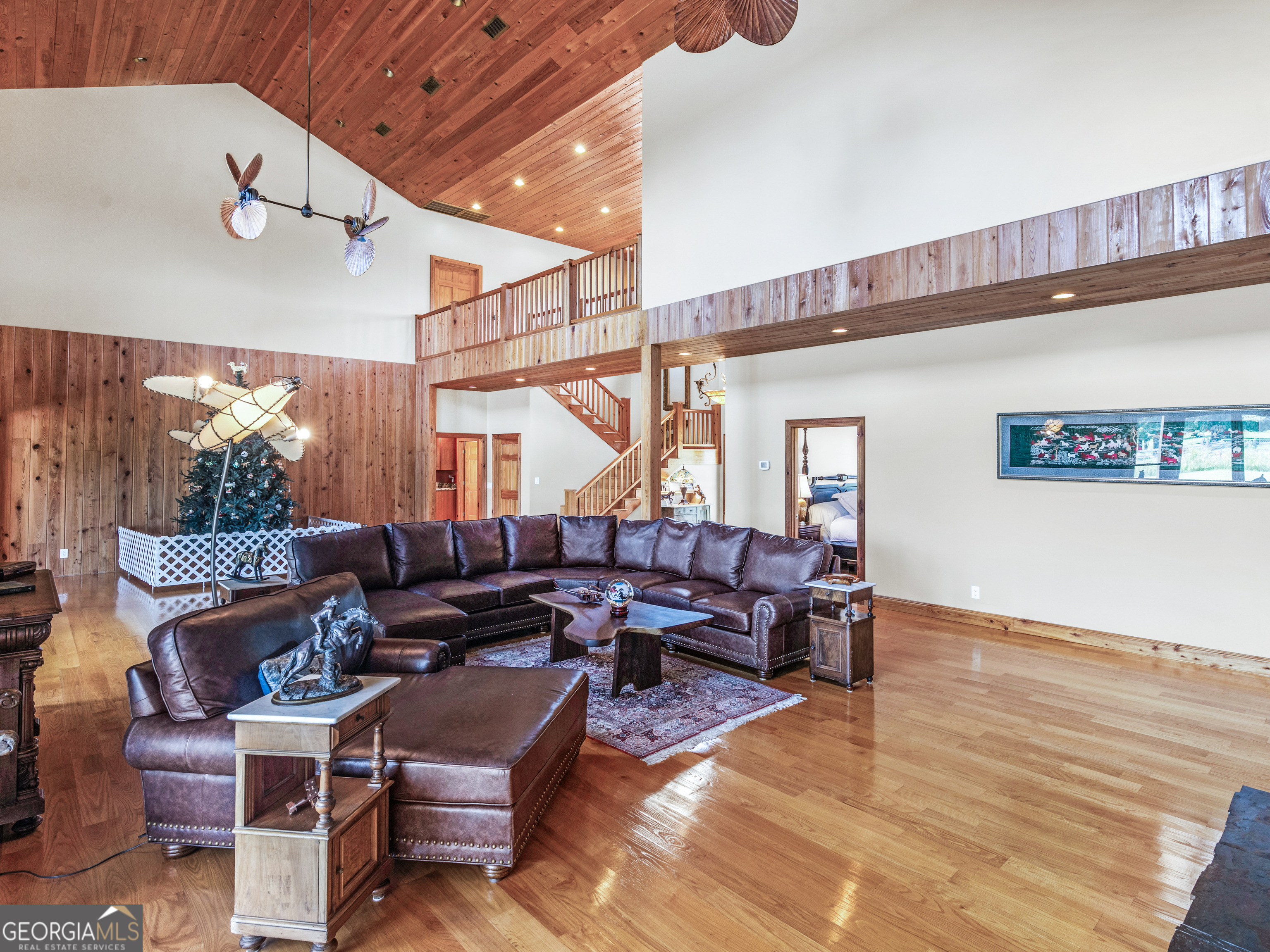 2051 Gough Road Louisville, GA 30434 - Photo 11 of 95 a living room with furniture and a wooden floor