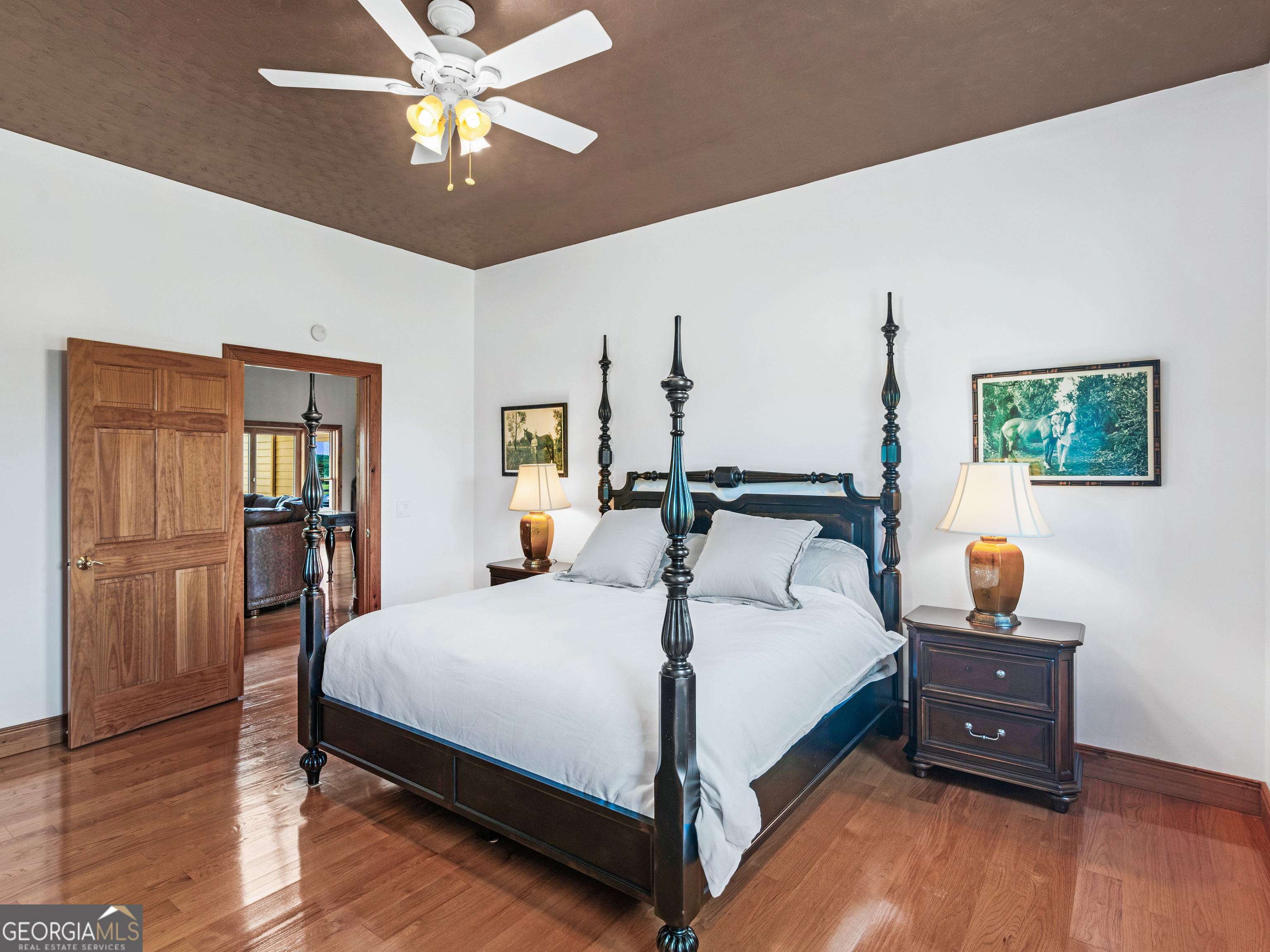 2051 Gough Road Louisville, GA 30434 - Photo 15 of 95 a bedroom with a bed and wooden floor