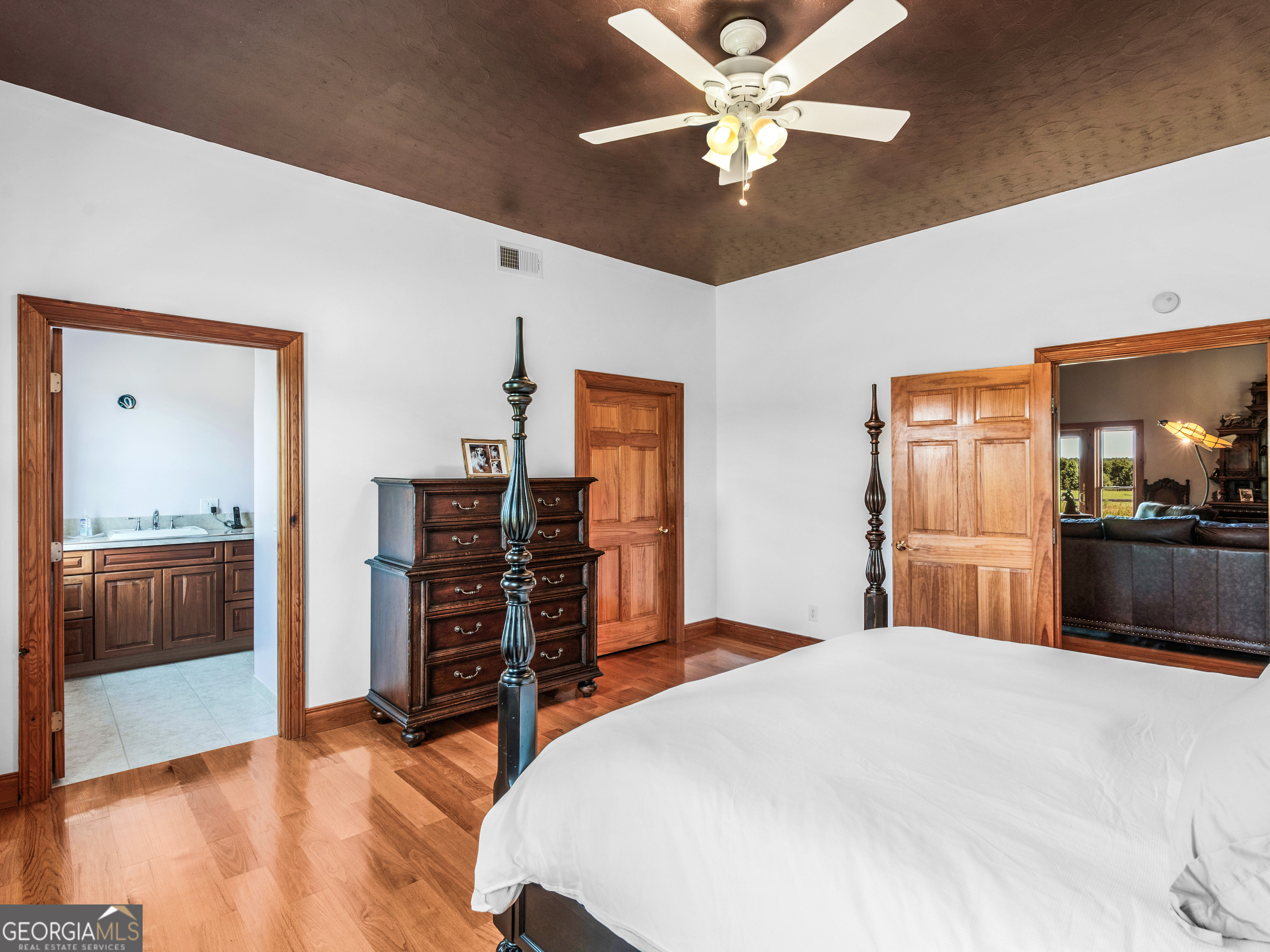 2051 Gough Road Louisville, GA 30434 - Photo 16 of 95 a bedroom with a large bed and a dresser