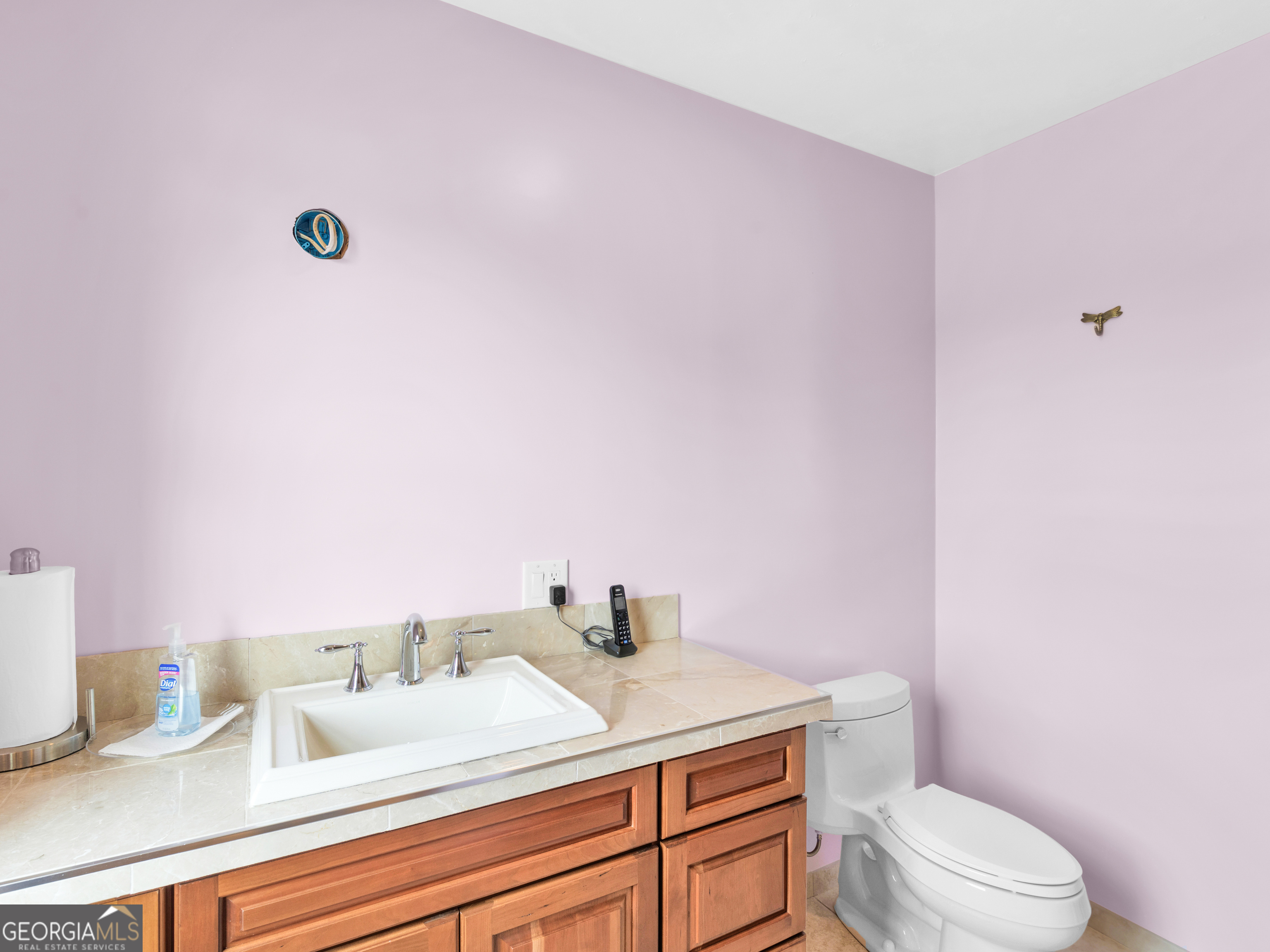 2051 Gough Road Louisville, GA 30434 - Photo 17 of 95 a bathroom with a granite countertop sink mirror vanity and toilet