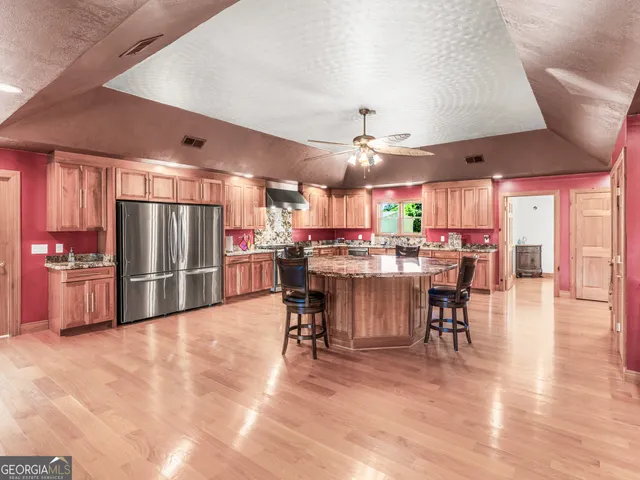 a kitchen with a table and chairs in it