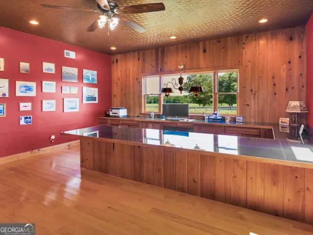 a view of a dining room with furniture window and garden view