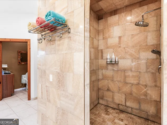 an aerial view of a house with a swimming pool