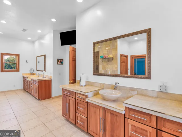 an aerial view of residential houses with outdoor space and street view