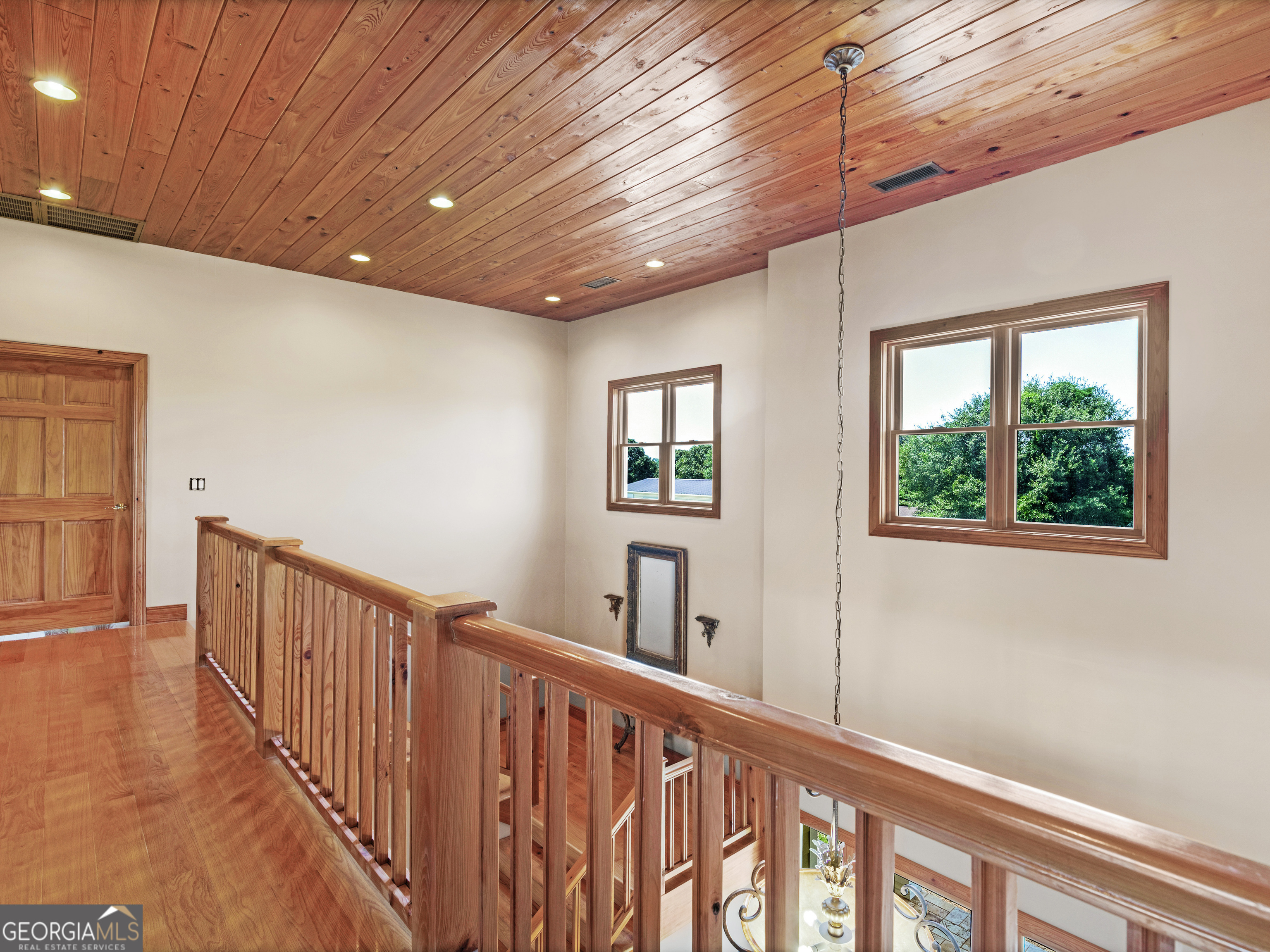 2051 Gough Road Louisville, GA 30434 - Photo 53 of 95 a view of a hallway with wooden floor and staircase
