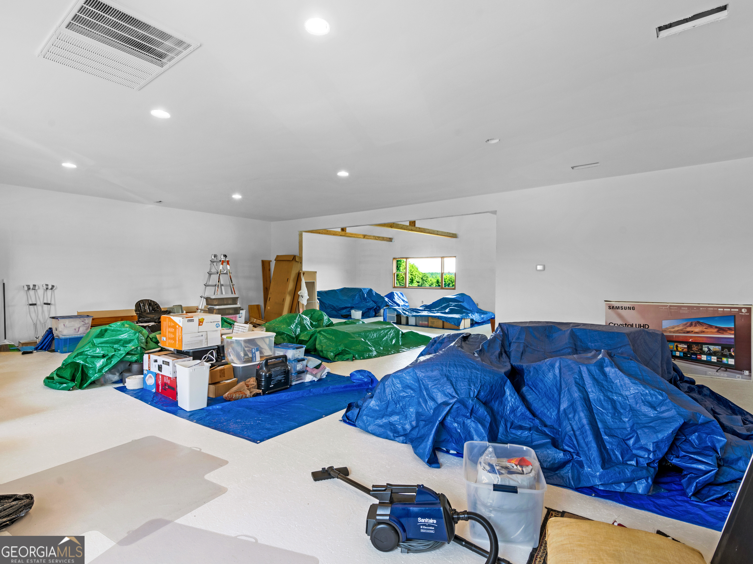 2051 Gough Road Louisville, GA 30434 - Photo 57 of 95 a living room filled with furniture and a floor to ceiling window