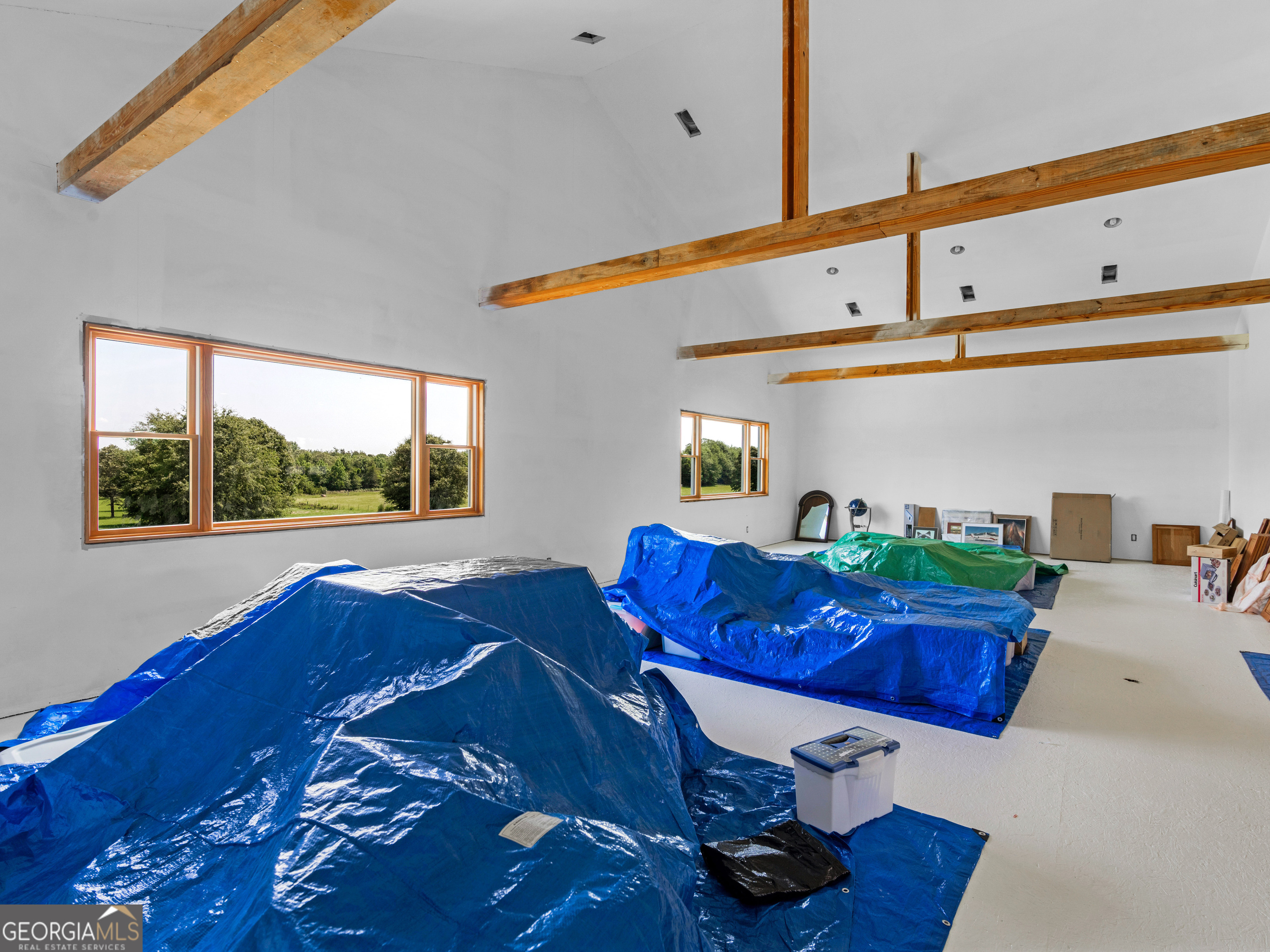 2051 Gough Road Louisville, GA 30434 - Photo 60 of 95 a living room with furniture and a floor to ceiling window
