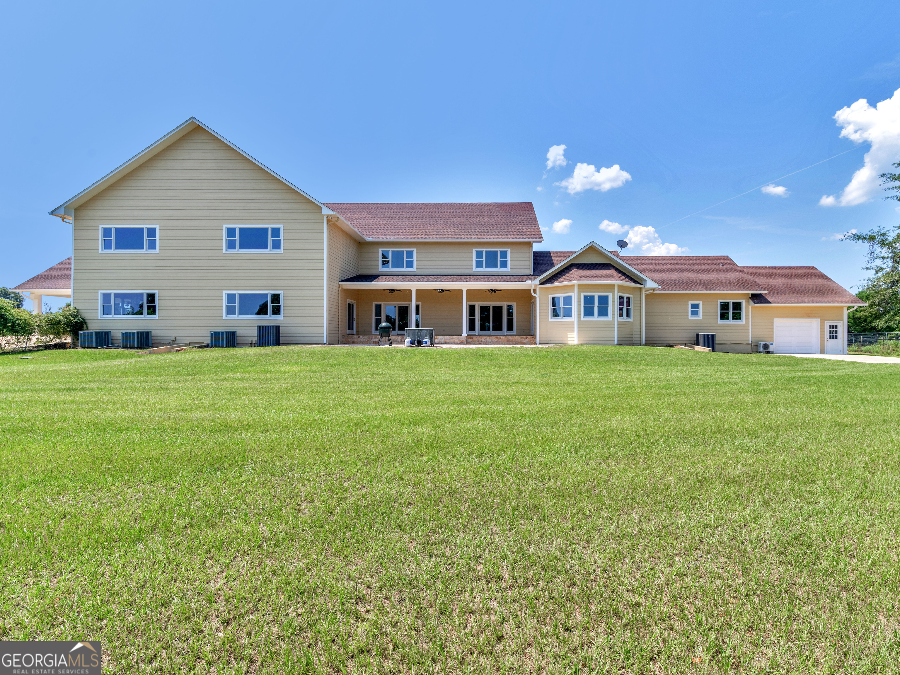 2051 Gough Road Louisville, GA 30434 - Photo 63 of 95 a view of a house with a yard and sitting area