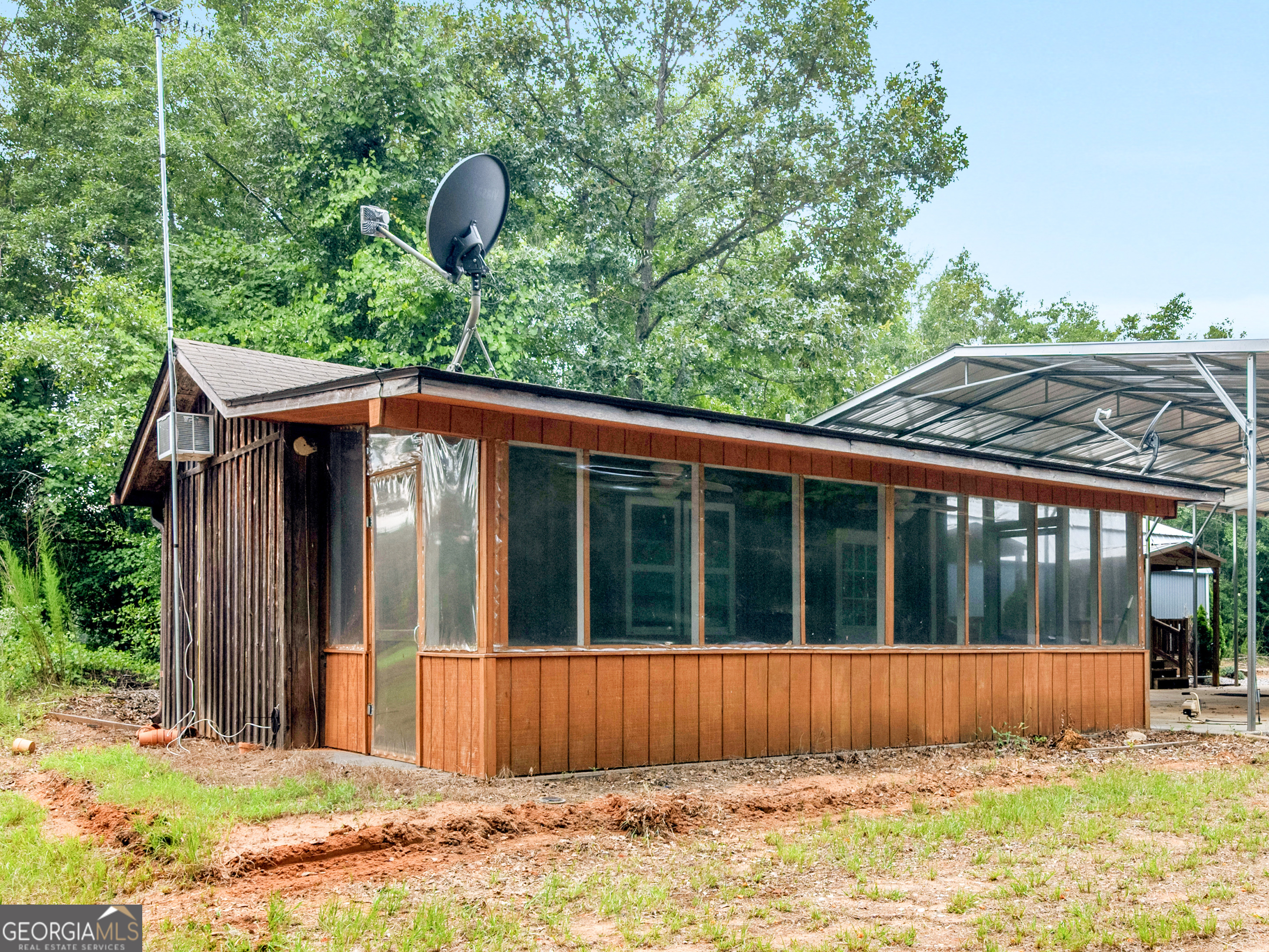 2051 Gough Road Louisville, GA 30434 - Photo 79 of 95 a view of a house with a swimming pool and a large tree