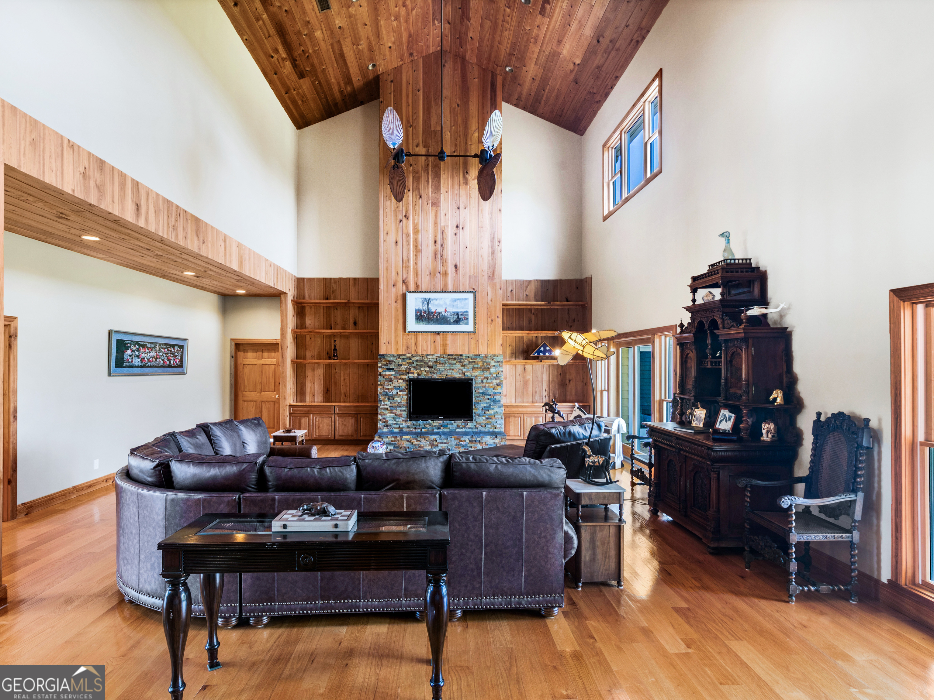 2051 Gough Road Louisville, GA 30434 - Photo 10 of 95 a living room with furniture a fireplace and a flat screen tv